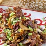 Stir-fried Mongolian beef on a plate.