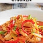 Firecracker chicken with peppers and sauce in a bowl.