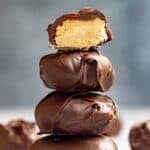 A stack of chocolate covered peanut butter candy eggs.