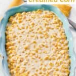 Cream cheese creamed corn in a ceramic baking dish.