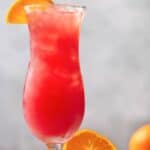 Homemade armadillo punch cocktail in a hurricane glass.