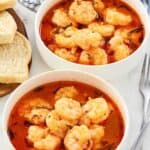 Shrimp cooked and served in a rich tomato herb broth.