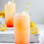Copycat McDonald's frozen strawberry lemonade in a tall glass.
