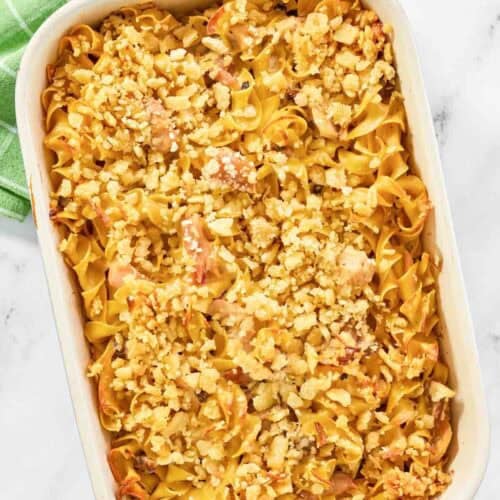 A baked casserole with tuna, mushrooms, and noodles topped with crispy buttery crackers.