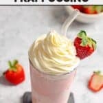 Copycat Starbucks strawberry frappe with whipped cream and a strawberry on top.