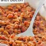 BBQ baked beans with bacon in a baking dish.