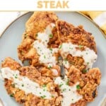 Crispy beer battered chicken fried steaks on a platter.
