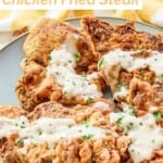 Four beer battered chicken fried steaks on a plate.