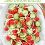 Homemade Cracker Barrel cucumber tomato and onion salad on an oval platter.