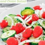 Copycat Cracker Barrel cucumber tomato and onion salad on a plate.