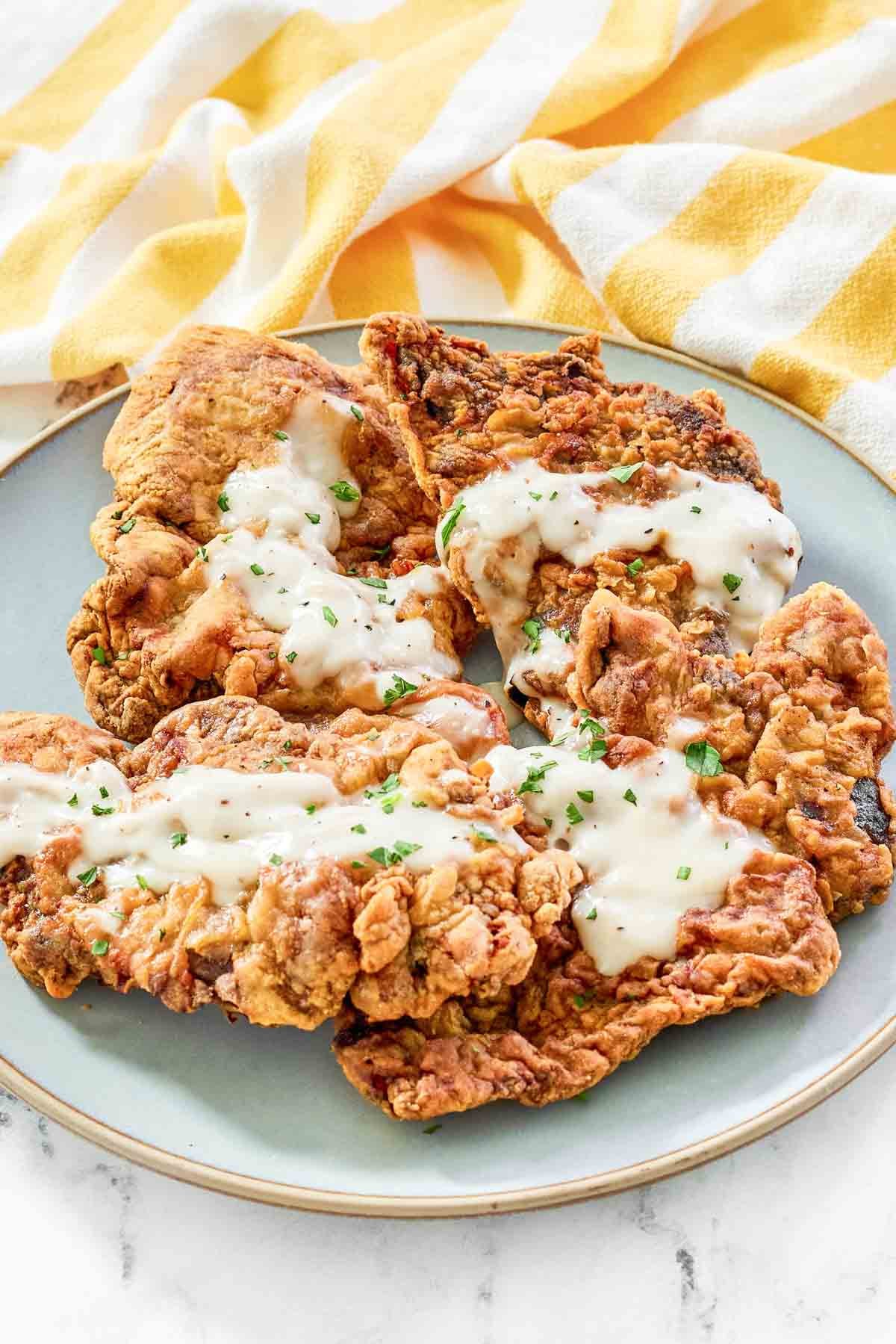 Crispy batter fried steaks topped with cream gravy.