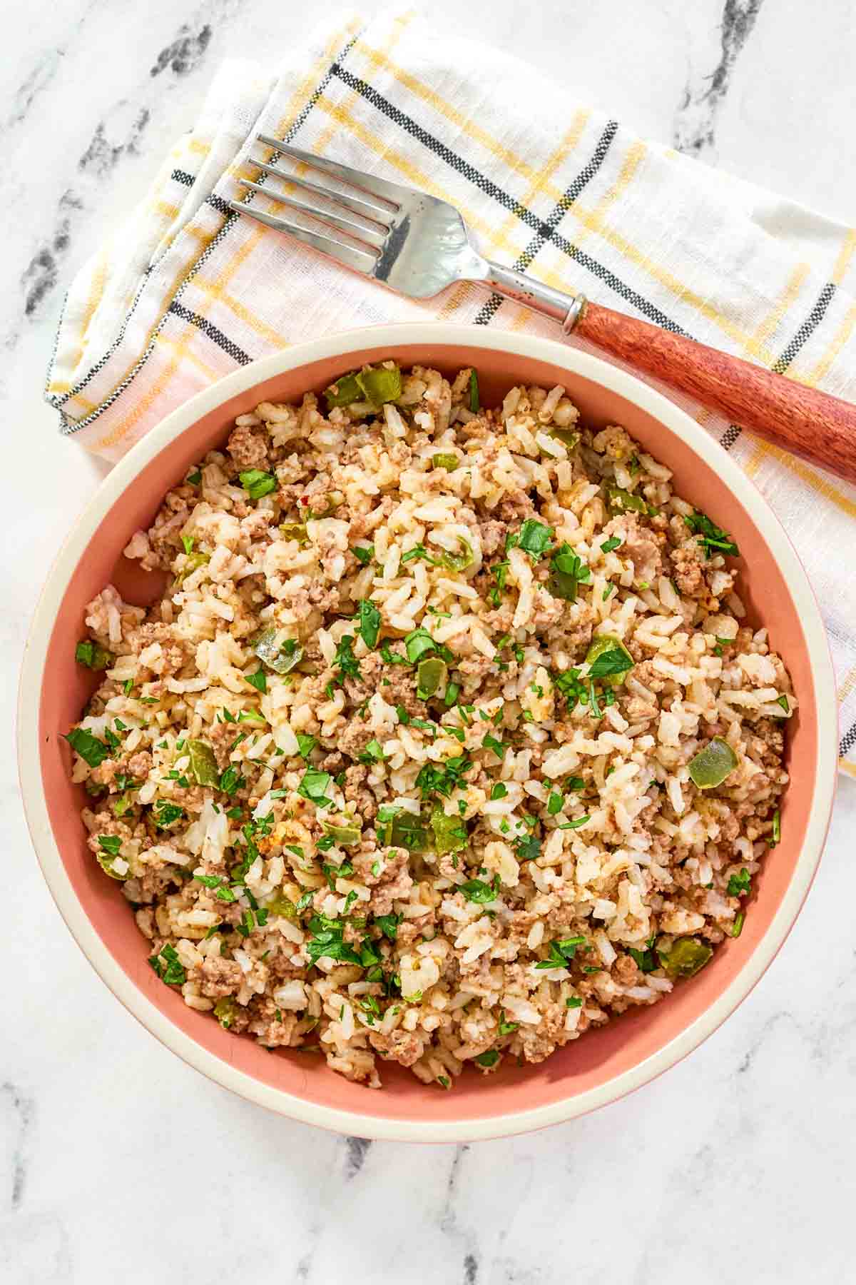 Ground beef and chicken gizzard Cajun seasoned rice dish.