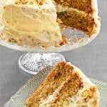 A slice of zucchini cake with cream cheese frosting and the cake on a stand behind it.