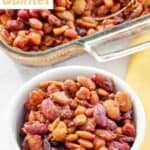 A serving of baked beans quintet in front of the casserole.