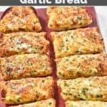 Copycat Black Angus Steakhouse cheesy garlic bread sliced and served.
