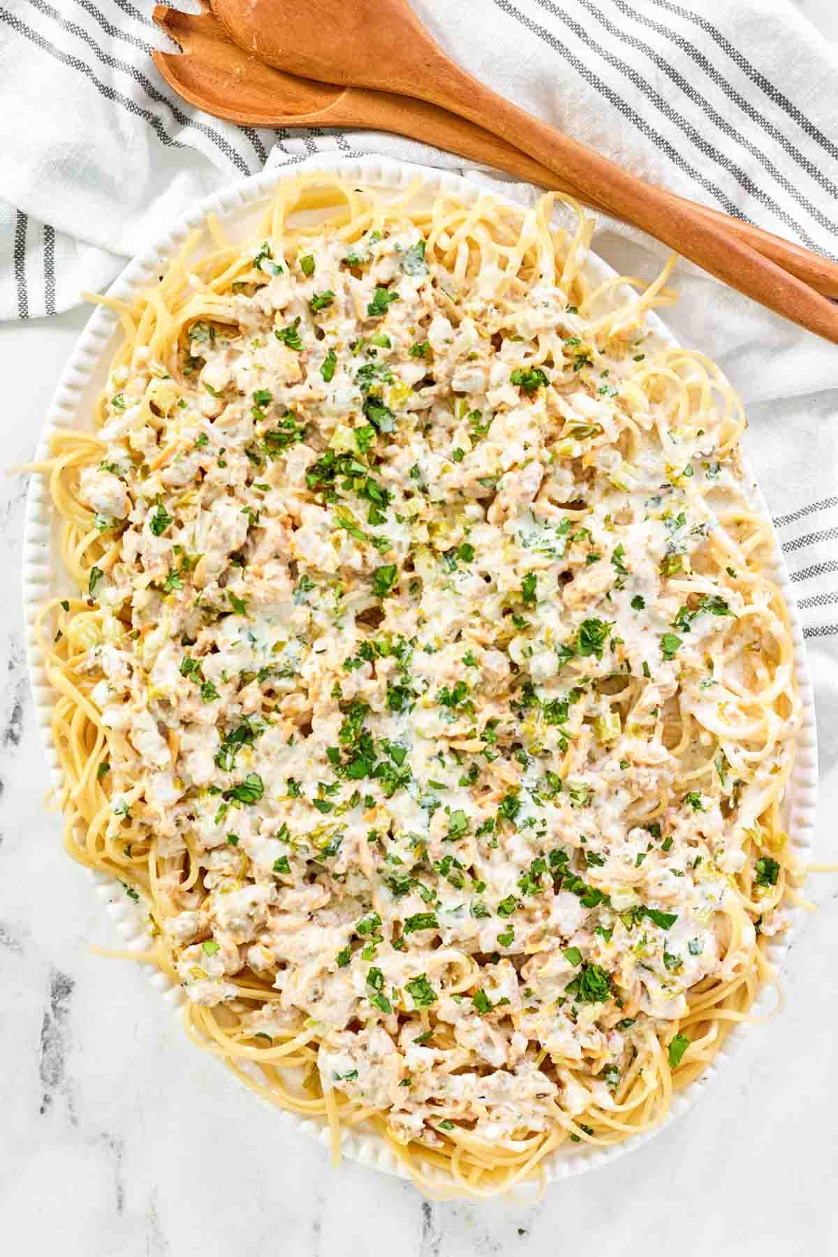 Creamy clam sauce served over pasta on a large platter.