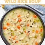 Copycat Jason's Deli chicken and wild rice soup in a bowl on a marble surface.