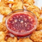 Copycat Joe's Crab Shack dipping sauce and fried shrimp on a platter.