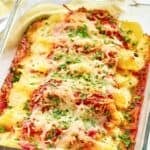 Copycat Olive Garden four cheese manicotti in a glass baking dish.