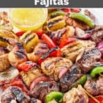 Copycat Pappasito's mixed grill fajitas with veggies and pineapple served with garlic butter sauce.