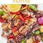 Copycat Pappasito's mixed grill fajitas skewers served with garlic butter sauce.