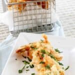 Crispy shrimp tempura on a small plate.