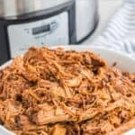 Slow cooker pulled pork in a bowl.