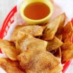Copycat Taco Bell Crispitos and a small cup of syrup for dipping.