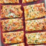 Baked green onion, garlic, and cheese French bread slices.