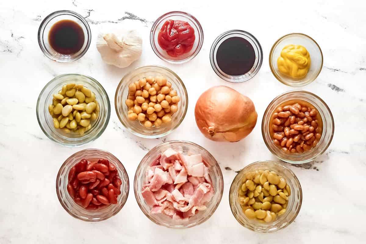 Beans, bacon, onion, garlic, ketchup, mustard, molasses, and brown sugar.