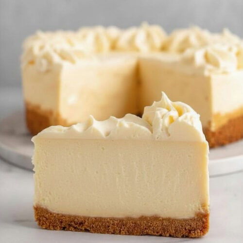Cheesecake topped with buttercream frosting.