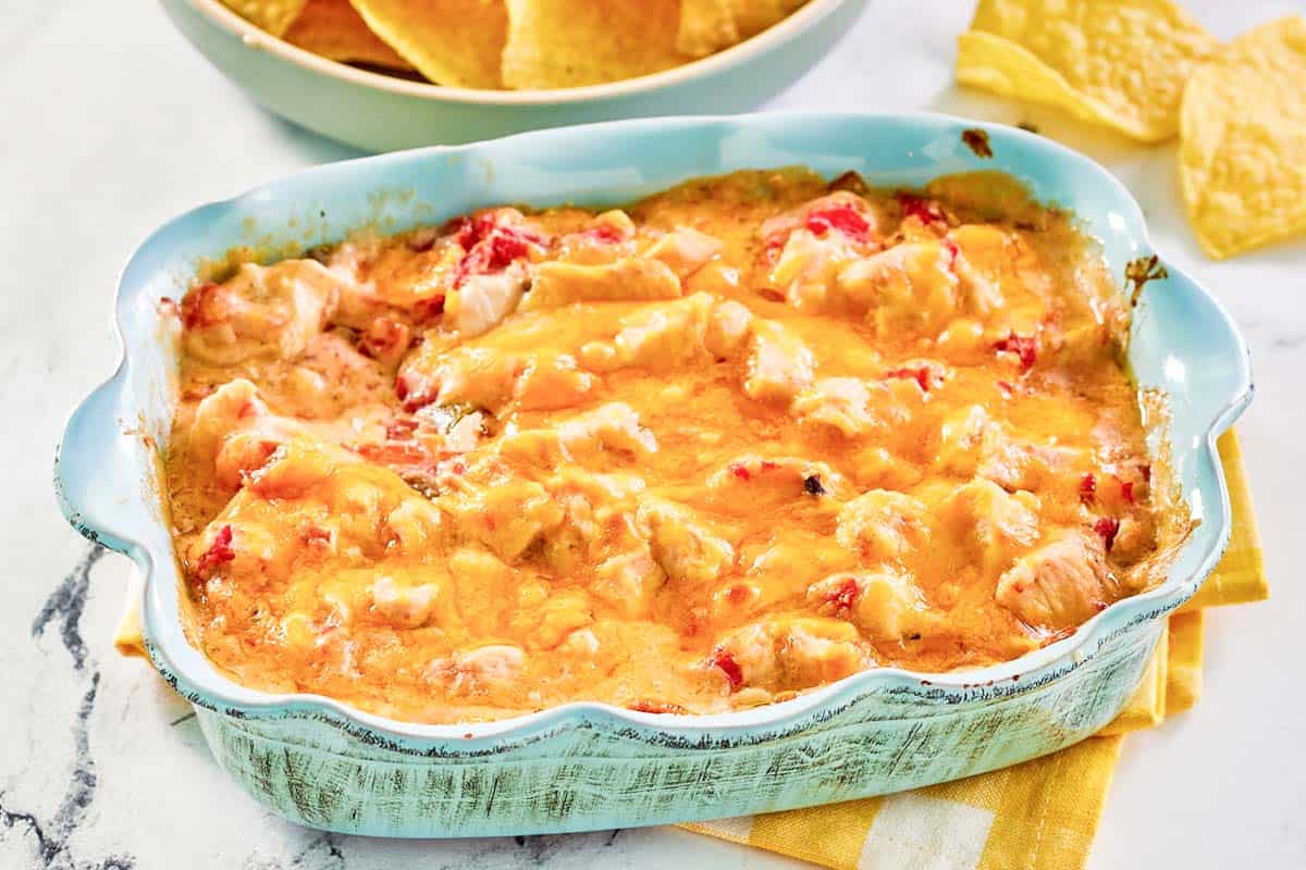 A creamy cheese, tomato, and green chile chicken dip.