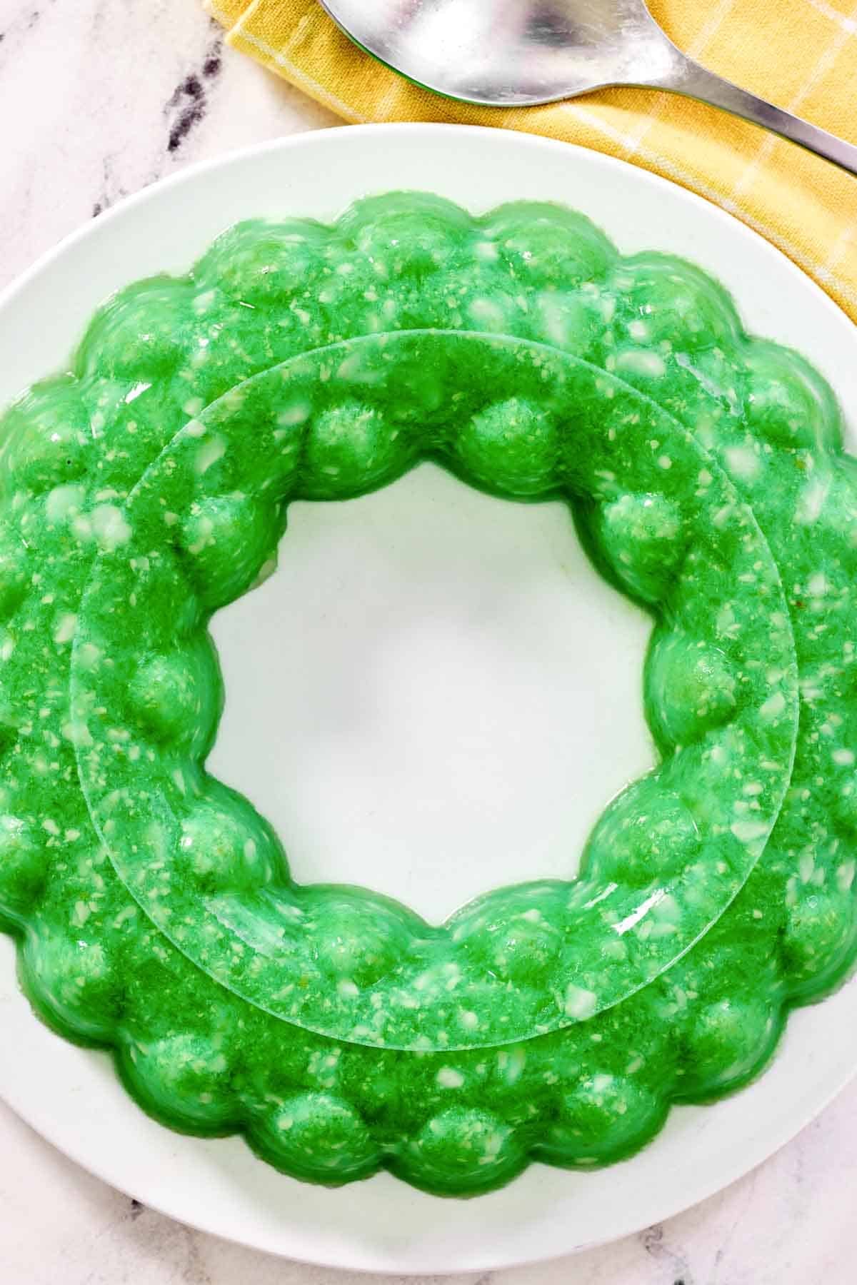 A lime gelatin salad with cottage cheese and pineapple.