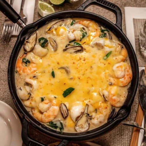Cheesy fondue with oysters and shrimp.
