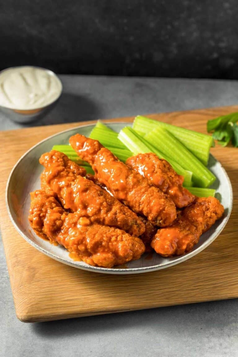 Fried chicken tenders coated in buttery hot sauce served with celery sticks and blue cheese dressing.