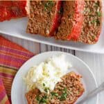 Slices of copycat Boston Market meatloaf on a platter and one on a plate with mashed potatoes.