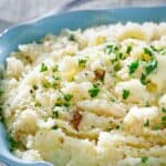 Copycat Cracker Barrel mashed potatoes garnished with parsley.