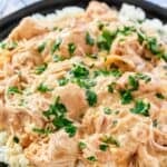 Crockpot chicken and creamy gravy over rice.