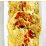 A platter of homemade egg foo young with gravy.