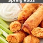 Copycat Grand Lux Cafe Buffalo chicken spring rolls on a plate with celery and blue cheese dressing.