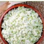 Homemade coleslaw in a small wooden bowl.