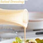 Pouring copycat Houston's buttermilk garlic dressing on a salad.