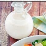A bottle of copycat Old Spaghetti Factory creamy pesto salad dressing.