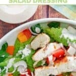 A salad with copycat Old Spaghetti Factory creamy pesto dressing on it.