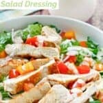 Copycat Old Spaghetti Factory creamy pesto salad dressing in a bottle and on a salad.