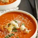A bowl of copycat Panera tomato soup topped with croutons.