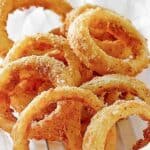 Copycat Sonic onion rings on parchment paper.