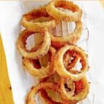 Copycat Sonic onion rings in a parchment paper lined basket.