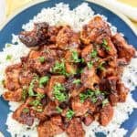 Brown sugar bourbon sauce chicken thigh pieces served over rice.