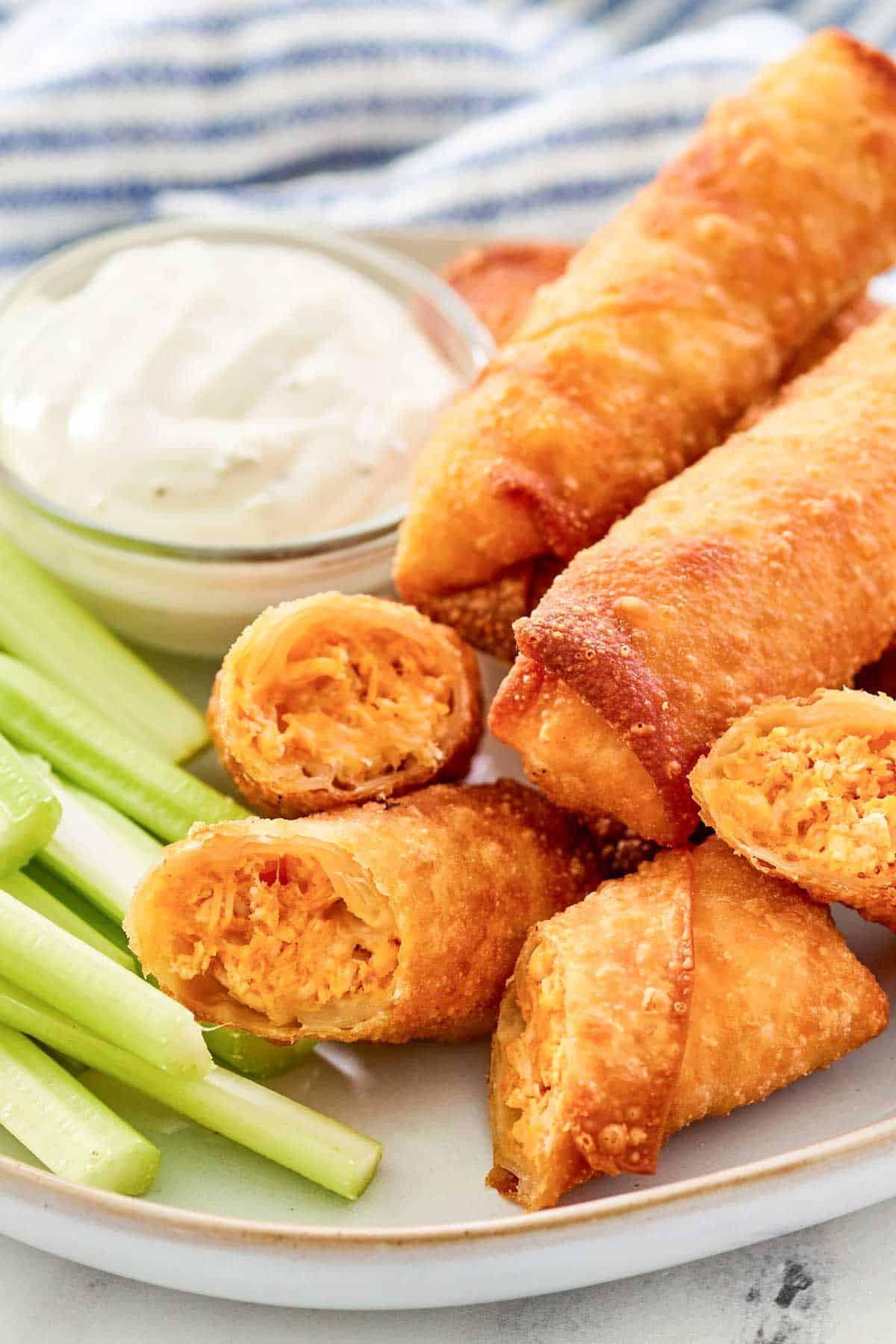 Crispy and cheesy Buffalo chicken spring roll appetizer.
